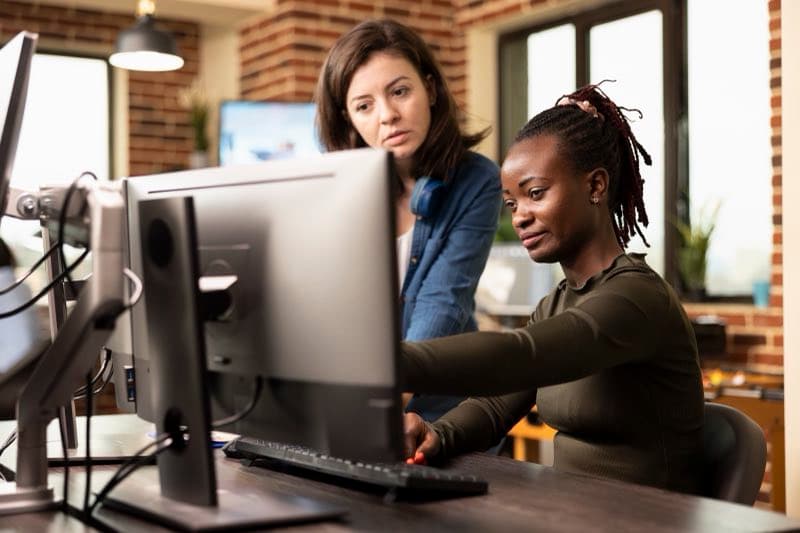 Diverse team working at computer